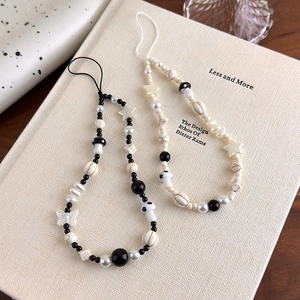 Handmade beaded phone charms with stars, mushrooms, and pearls in black and white styles