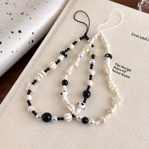 Bohemian style beaded phone charms set with star, mushroom, and butterfly resin beads