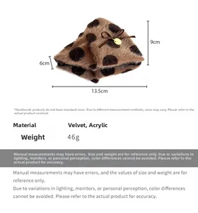Detailed view of plush polka dot hair claw with dimensions 13.5cm x 9cm x 6cm