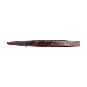 Minimalist acetate hair clip with tortoise shell pattern and gold metal logo