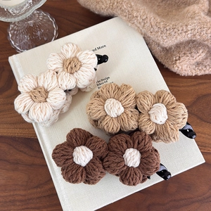 Vintage knit flower banana hair clips in warm earthy tones for autumn and winter styles