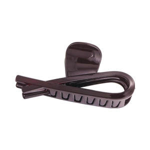 Macro shot of chocolate brown hair claw clip with glossy finish and crossover design