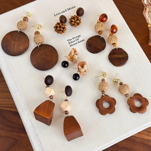 Bohemian geometric wooden drop earrings with woven patterns and amber resin elements