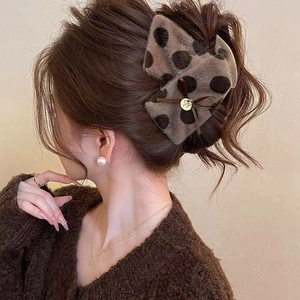 Plush brown polka dot bow shark hair claw clip with golden pendant for women