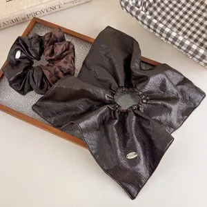 Brown faux leather bow scrunchie set with leopard print and golden logo charm