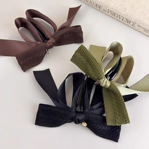 Retro knit and satin bow banana hair clips in brown, green, and black for high ponytails