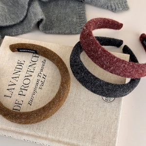 Three-pack felt padded headbands in brown, wine red and grey with handmade label tag