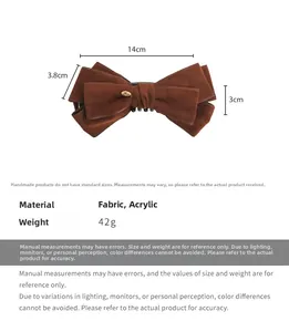 Detail view of brown suede bow hair clip showing 14cm dimensions and golden Love buckle