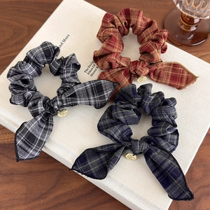 Vintage plaid bow scrunchies set in red, blue, and black colors with gold pendants