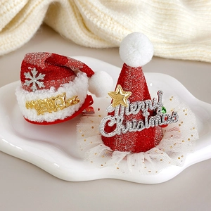 Detailed macro view of festive red mesh Christmas hat hair clips with glitter and fur trim