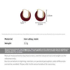 Detail view of red flocked earrings with 2.5cm height and 2.2cm width measurements