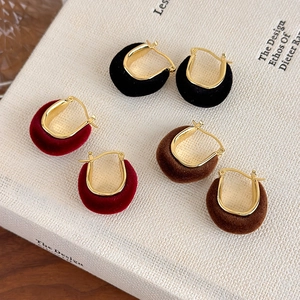 Vintage irregular flocked U-shaped hoop earrings in red, black, and brown with gold metal