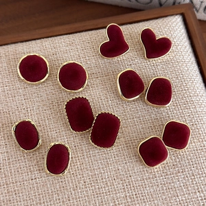 Vintage velvet earring set in burgundy with gold metal trim and multiple geometric shapes