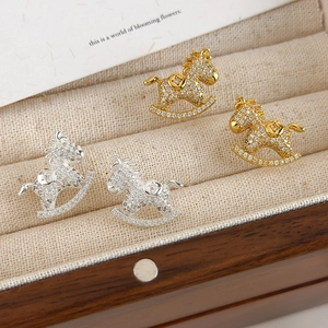 Exquisite gold and silver rocking horse stud earrings with sparkling pavé cubic zirconia