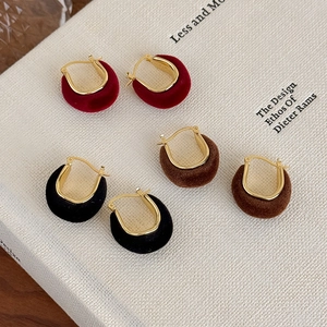 Three pairs of vintage U-shaped earrings in burgundy, dark brown and black velvet