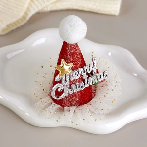 Macro detail of red glitter Christmas hat hair clip with mesh lace on ceramic tray