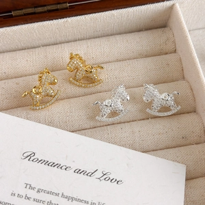 Exquisite gold and silver rocking horse stud earrings with sparkling cubic zirconia inlay