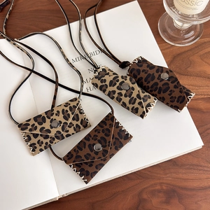 Leopard print mini bag necklaces in plush suede with long lanyards for autumn outfits