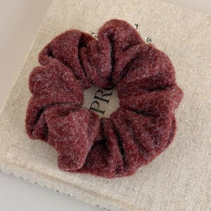 Close-up of deep burgundy wool scrunchie showing the soft autumn winter plush texture