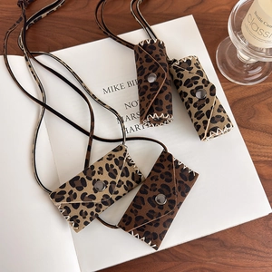 Maillard leopard print mini bag necklace with handmade stitching on suede material