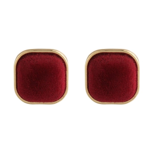 Detail of square velvet earrings with vintage gold metal frame and burgundy flocked finish