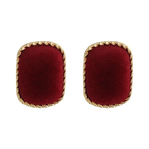 Detailed view of square velvet stud earrings with golden braided metal frames