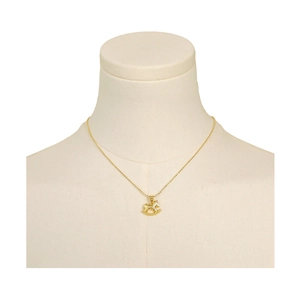 Elegant gold rocking horse pendant necklace on a jewelry bust with minimalist bead chain link