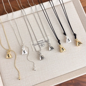 Detailed display of Chinese style money bag necklaces in gold, silver, and ivory colors