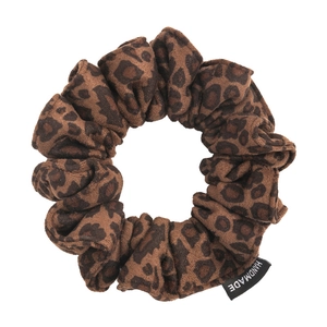 Minimalist leopard print suede scrunchie with handmade label for ponytail styling