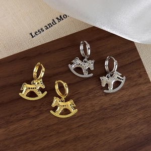 Elegant rocking horse hoop earrings in gold and silver with textured hammered finish