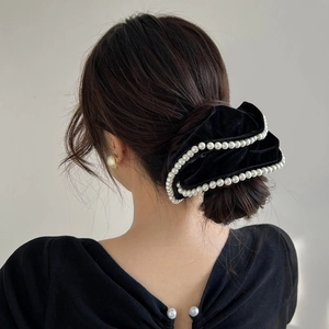 Elegant black velvet hair scrunchie with white pearls for a French vintage back hairstyle