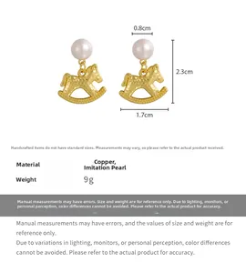 Detailed view of rocking horse gold earrings with pearl studs and hammered texture