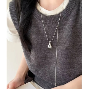 Silver money bag pendant necklace with dollar symbol and elegant long tassel chain