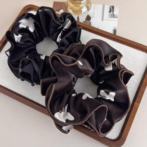 French velvet scrunchies set in black and brown with butterfly embroidery motifs