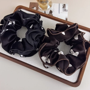 French velvet scrunchies set in black and dark brown with elegant butterfly patterns