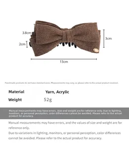 Brown knitted bow hair claw clip with measurements 13cm length and 52g weight detail