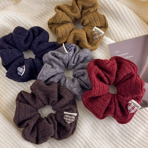 Set of 5 knit scrunchies in autumn colors with heart patches on cream fabric base