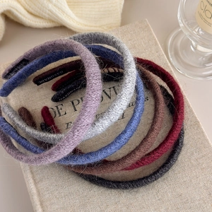 Winter fuzzy knitted thin headbands in various colors including grey, purple, and blue colors