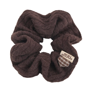 Coffee brown chunky knitted scrunchie with a check heart charm and small fabric label