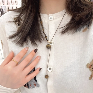 Minimalist Maillard style necklace with tiger eye beads and irregular stones on cord