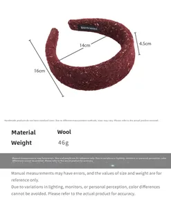 Detailed view of handmade burgundy wool blend headband with gold thread and sizing info
