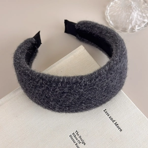 Detail of dark grey plush wide headband with soft faux mink texture for winter fashion