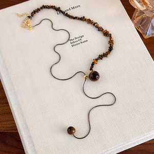 Irregular tiger eye stone necklace with gold snake chain and adjustable beads design