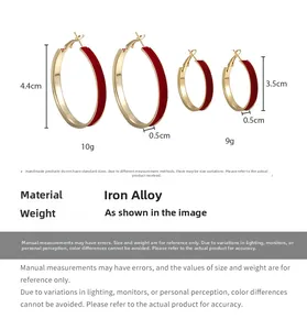 Detailed size view of red velvet hoop earrings with gold trim and material specs