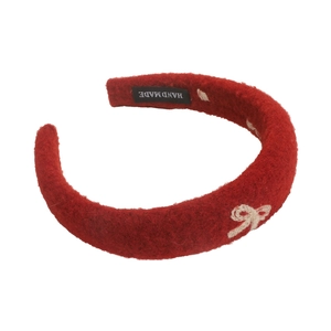 Elegant deep red plush headband with white bow embroidery and high crown silhouette