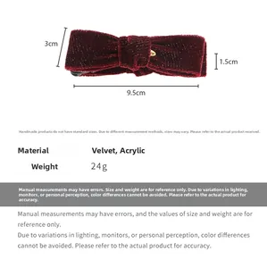 Macro detail of burgundy velvet bow banana clip showing 9.5cm length and dimensions