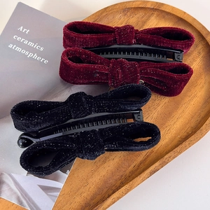 Vintage velvet bow banana hair clips in burgundy and black with subtle gold shimmer effect