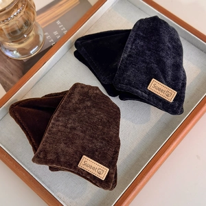 Winter vintage velvet triangle hair claw clips in black and dark brown shown in a warm tray