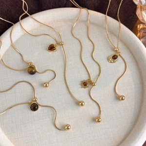 Vintage gold snake chain necklaces with tiger eye stone pendants in various shapes