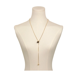 Elegant gold Y-shaped necklace featuring a tiger eye bead on a sleek snake chain